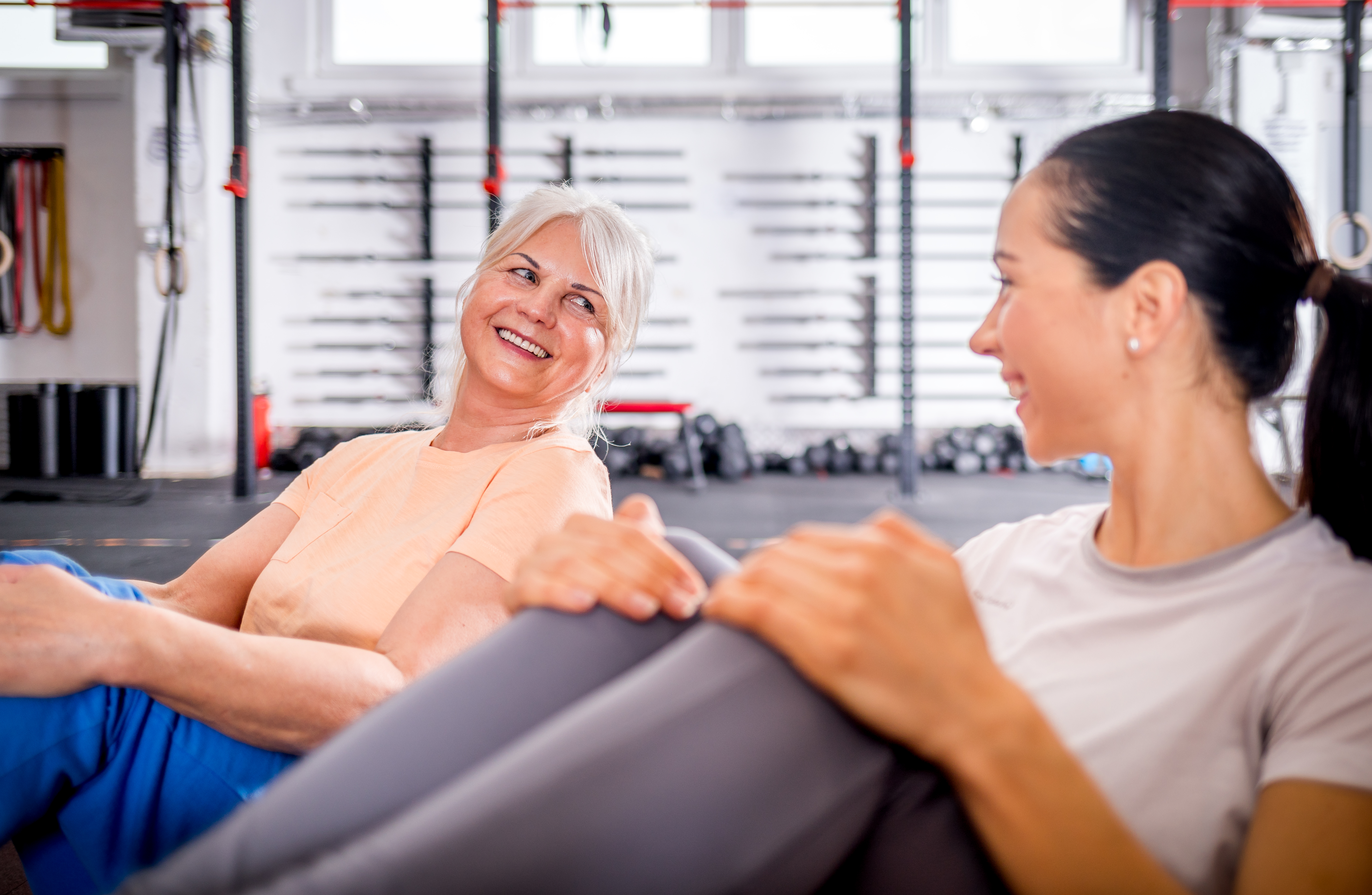 senior-woman-workout-with-trainer-at-the-gym-2026-03-10-22-29-18-utc